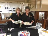 Members of the Hanover Lions Club and the special Oz cookies